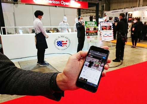 USMEF’s Tatsuru Kasatani live streams from the USMEF booth at the Supermarket Trade Show in Japan