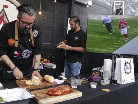U.S. beef and pork cuts are prepared for grilling at a workshop held during the Super Bowl pregame show
